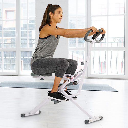 A woman using the squat assist trainer.