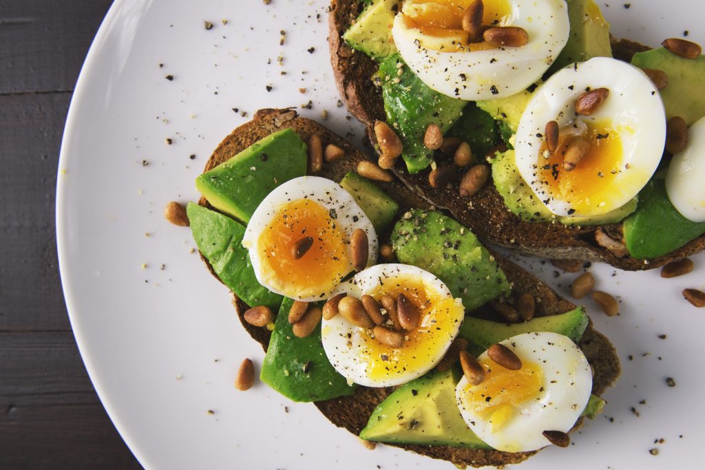 Close up of Egg and Avocado on a plate.