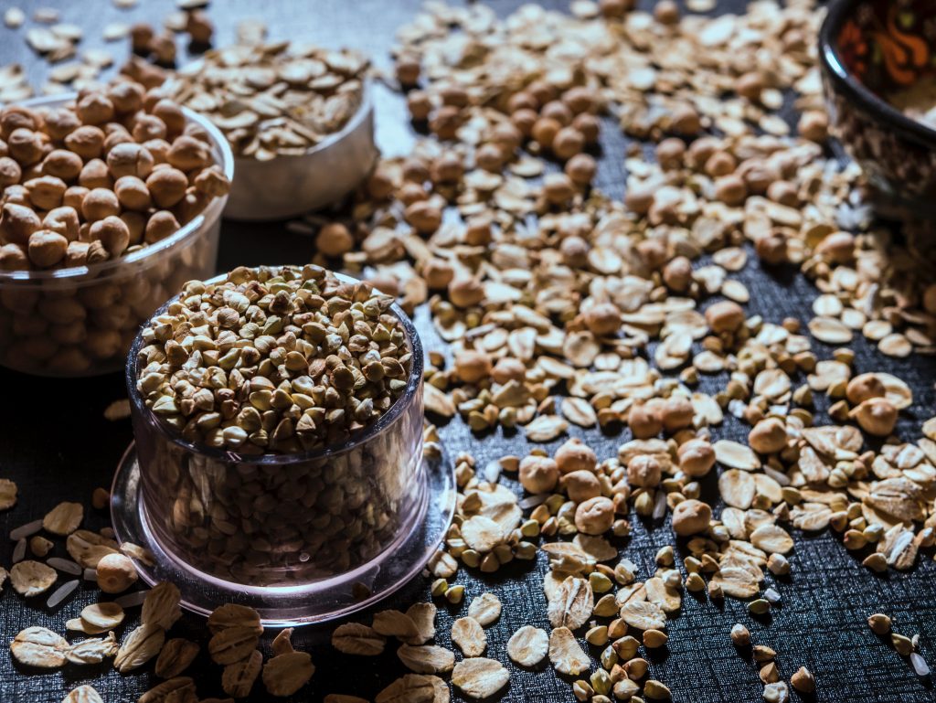 nuts and oats as healthy protein sources served in bowls
