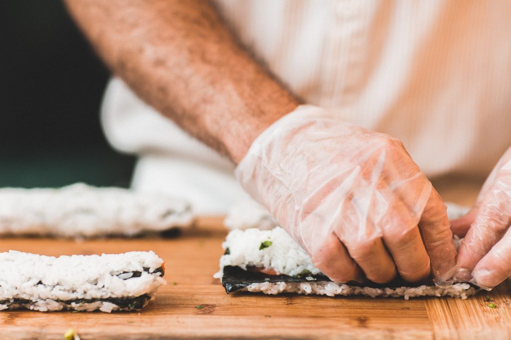 Man making sushi.