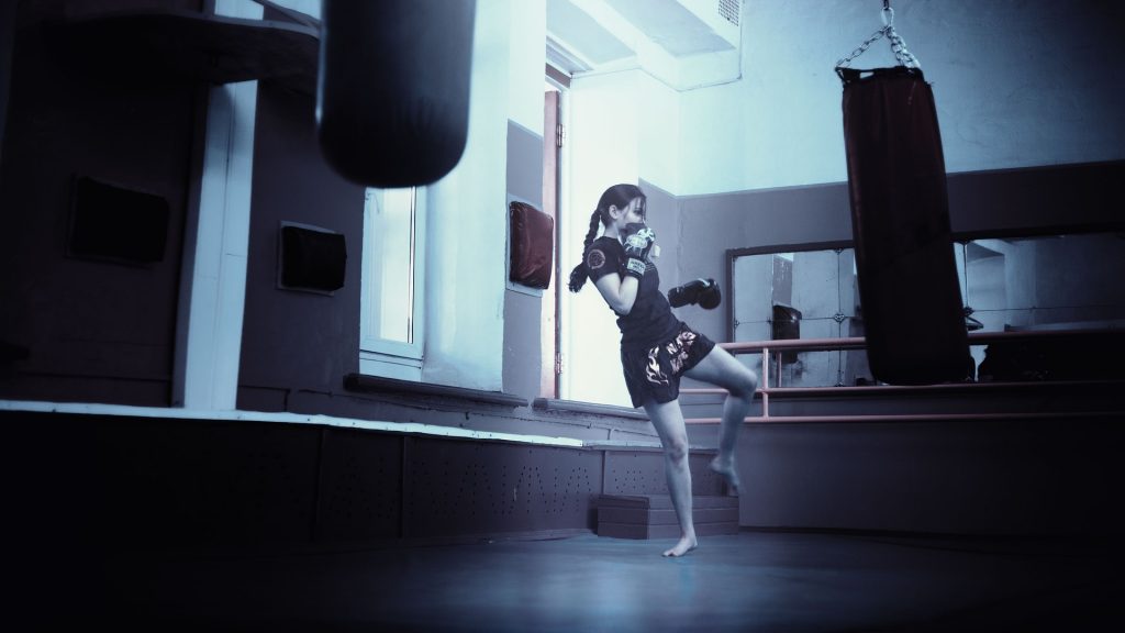 A woman doing kickboxing as a fun cardio workout