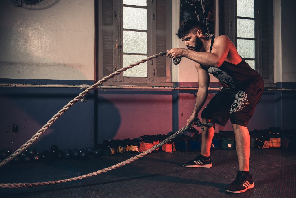 Man doing rope workout.