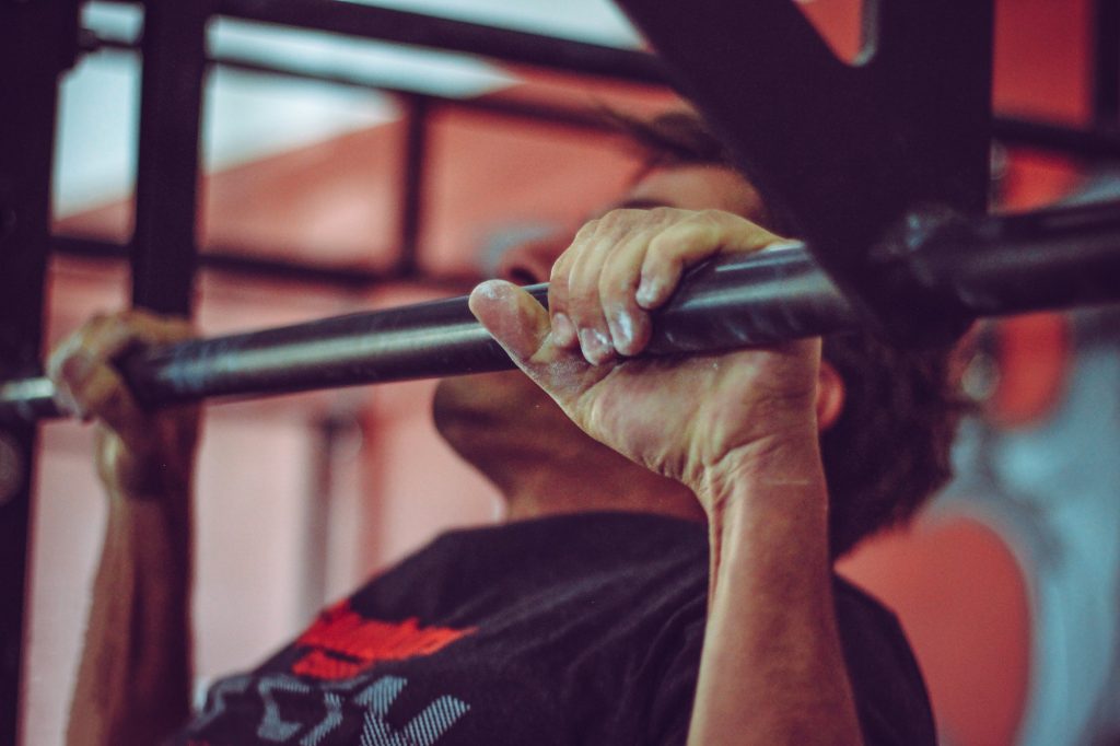 Man doing pull ups.