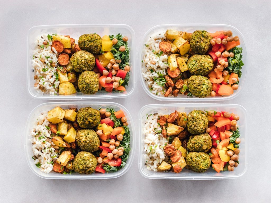 Packed meals in plastic food storage containers. Bringing your own food when you travel is one of the travel strategies for staying on track. Plus , it is healthier than snacking on some chips and other junk food.