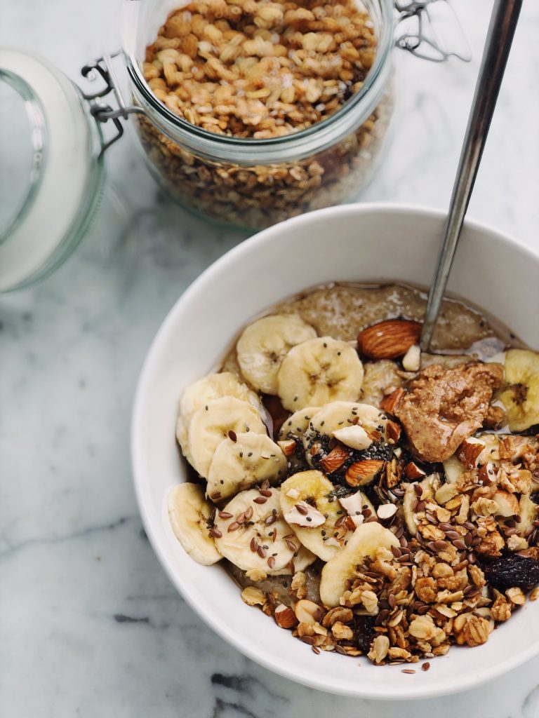 Granola and bananas in a bowl.