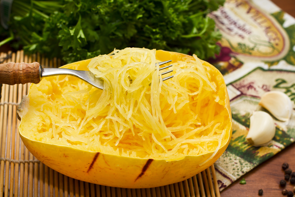 Making spaghetti from squash to cut calories for weight loss.