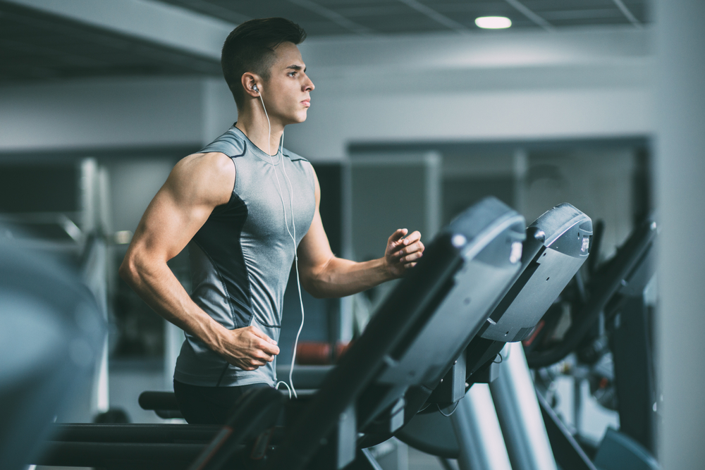 Man running on treadmill is one of the best cardio exercises.