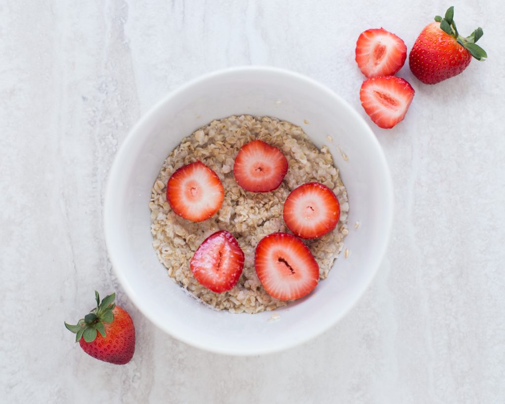 Oatmeal with strawberries in a bowl.