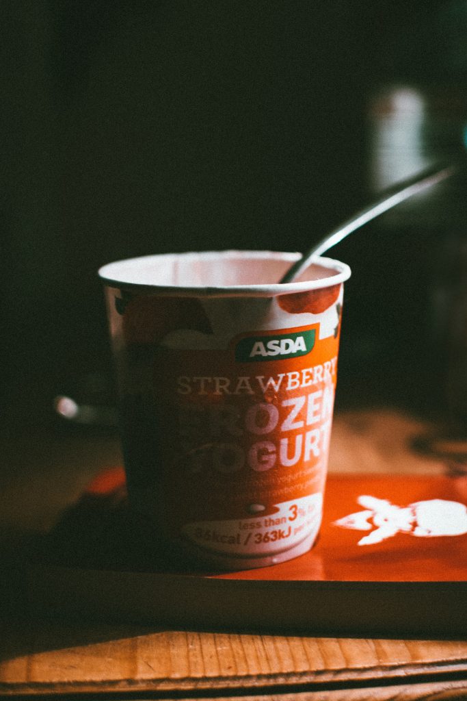 Frozen Yogurt on a table. Is this an unhealthy food?