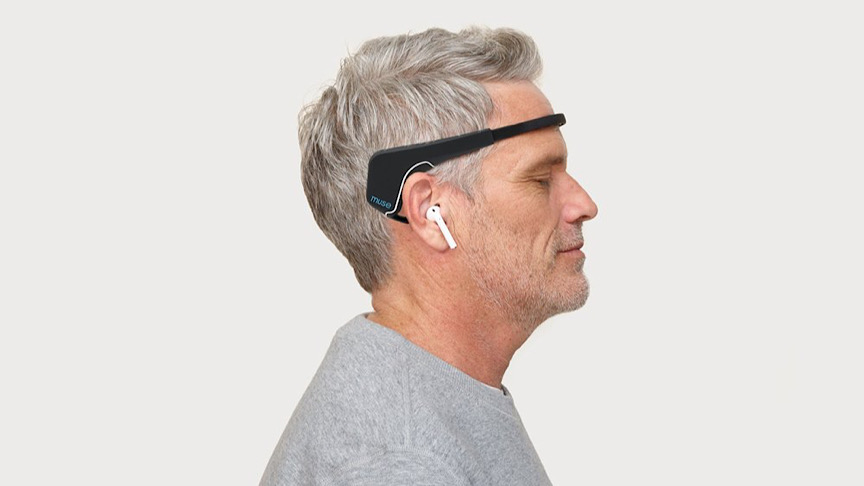 A man wearing grey shirt using the Muse 2.