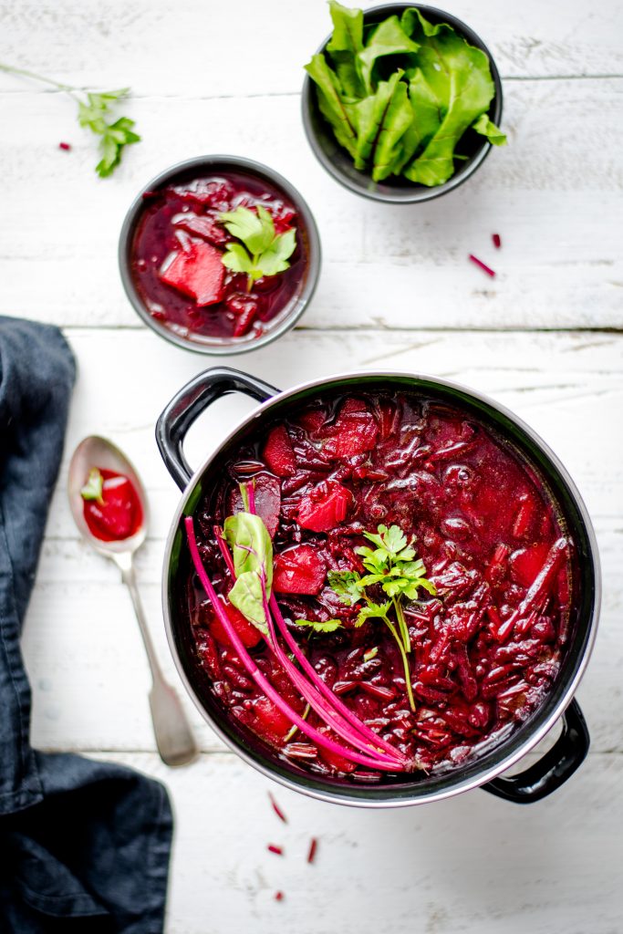 Beets mixed with red sauce in a pot.