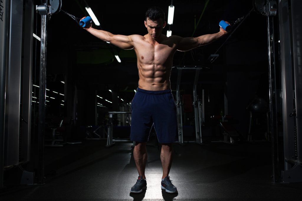 Man holding on to row excercise machine.