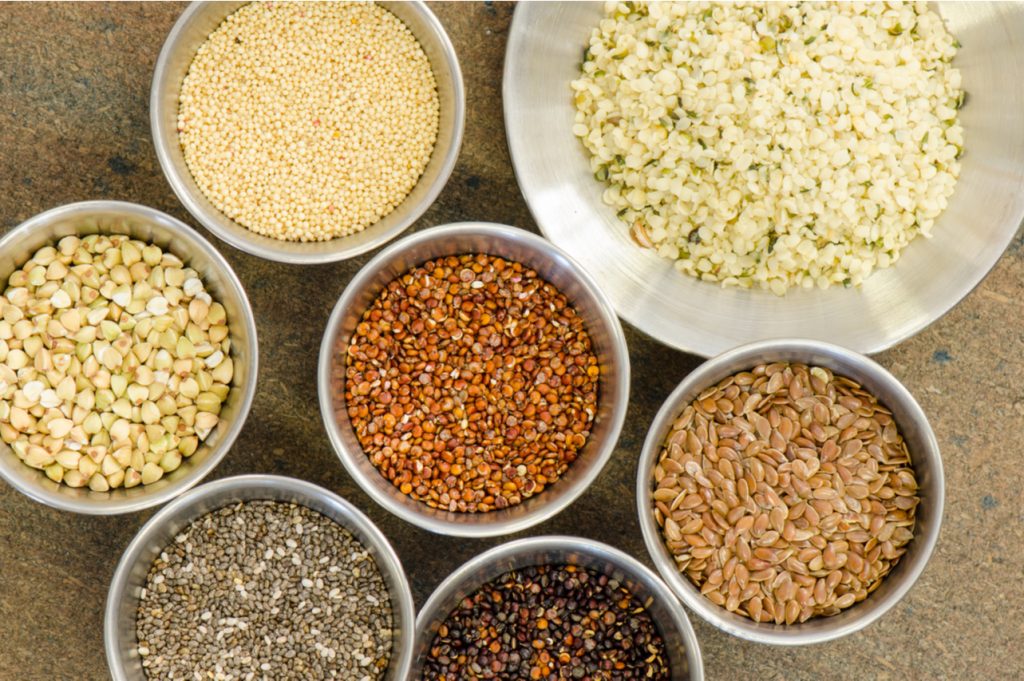 Ancient grains in aluminum bowls.