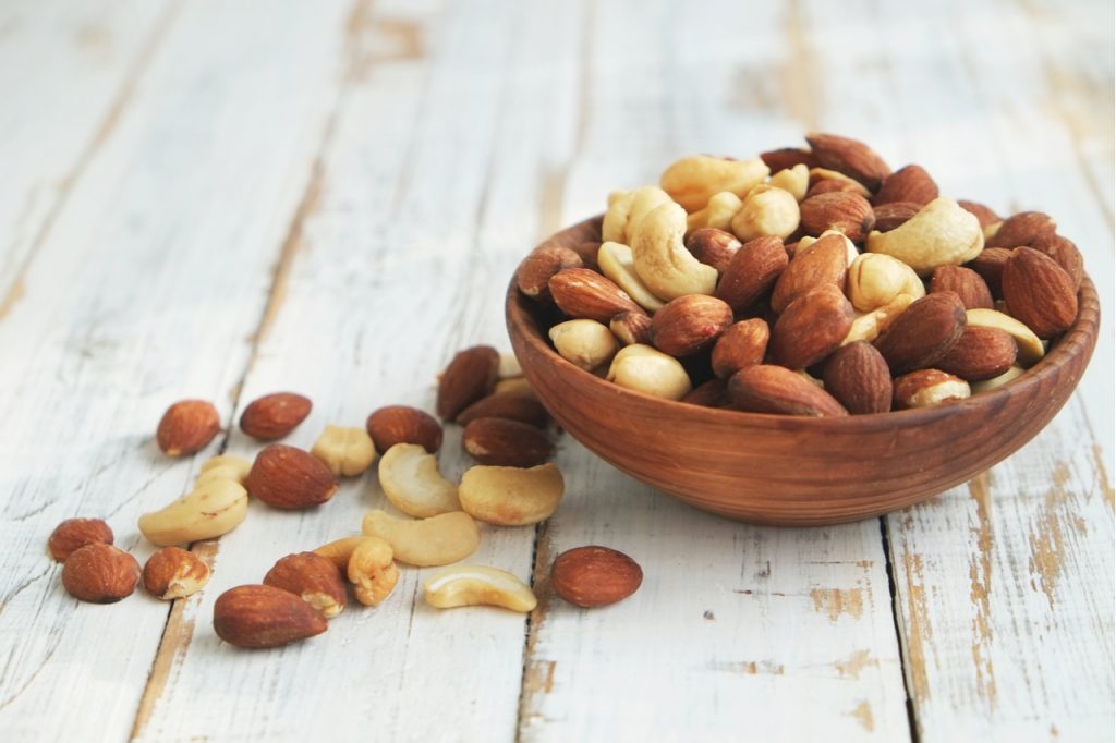 Mixed nuts in a wooden bowl.