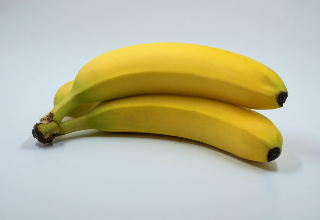 Three pieces of ripe banana on white background.
