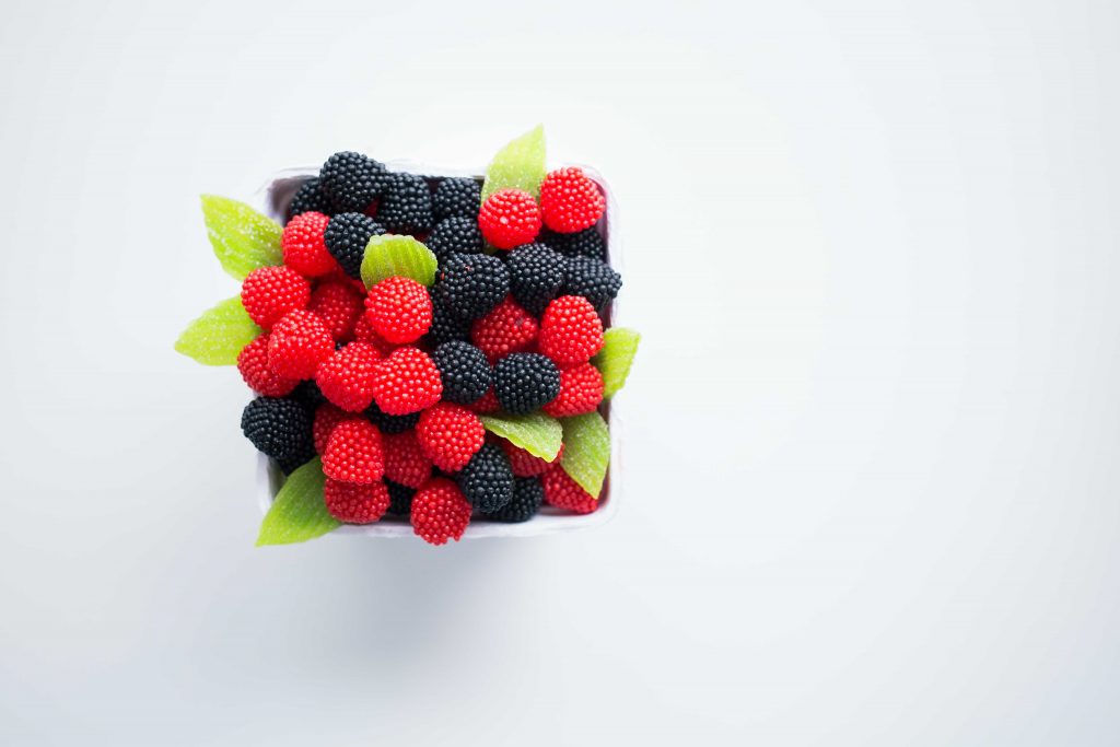 Cup of blackberries and raspberries.