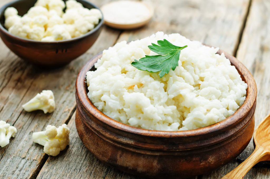 A bowl of cauliflower rice perfect for a lower calorie food alternative.