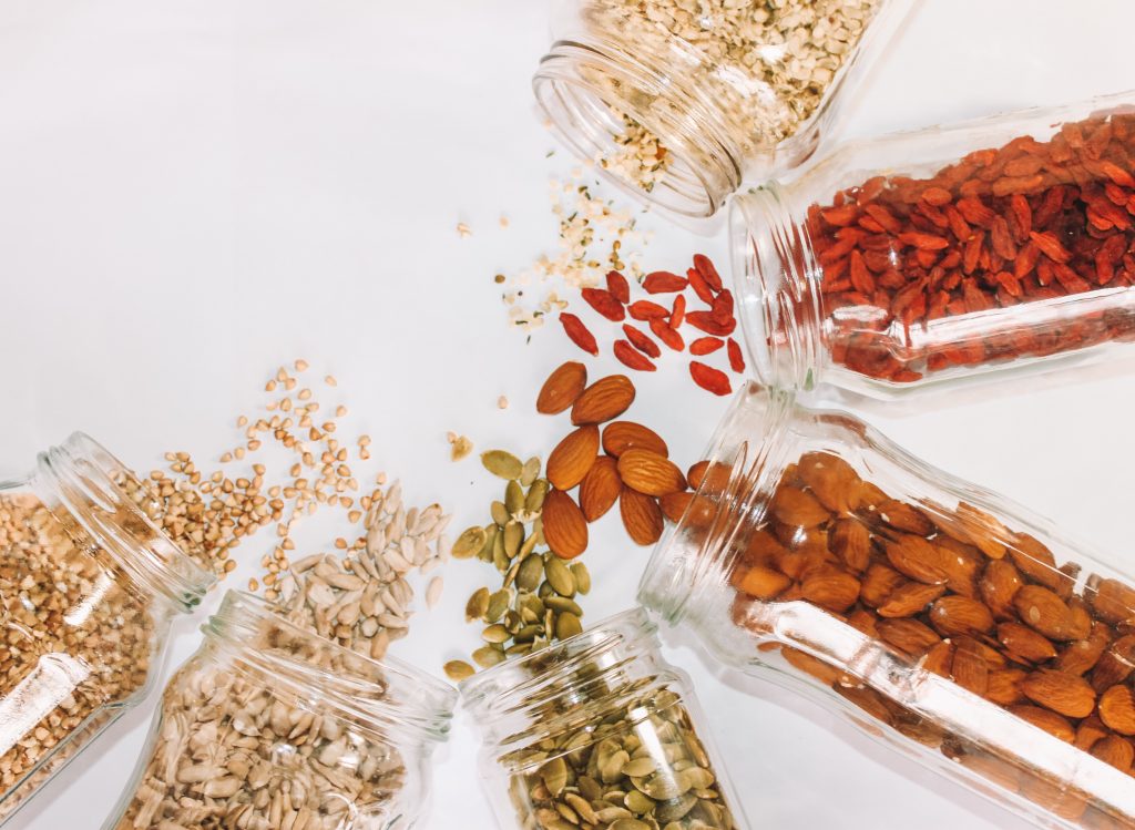 Multiple jars of different nuts.