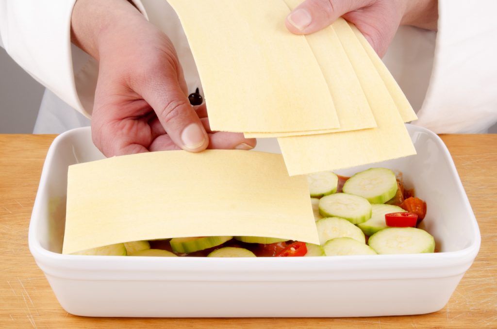 A tray of zucchini ready to be made into a flavorful lasagna.