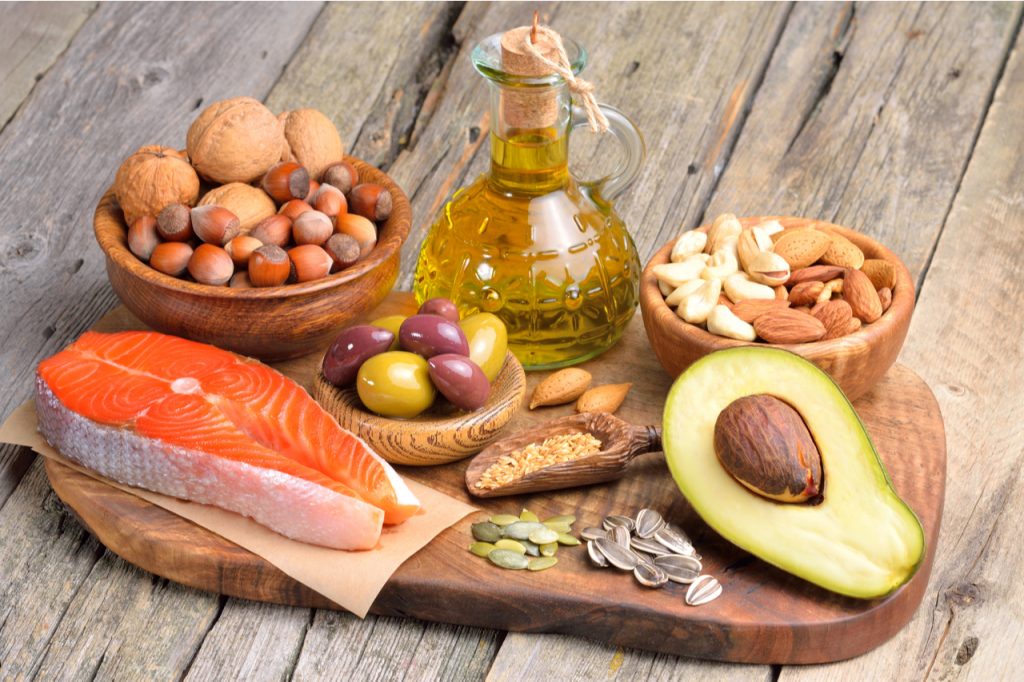 Salmon, avocado, and some nuts as healthy fat food sources.