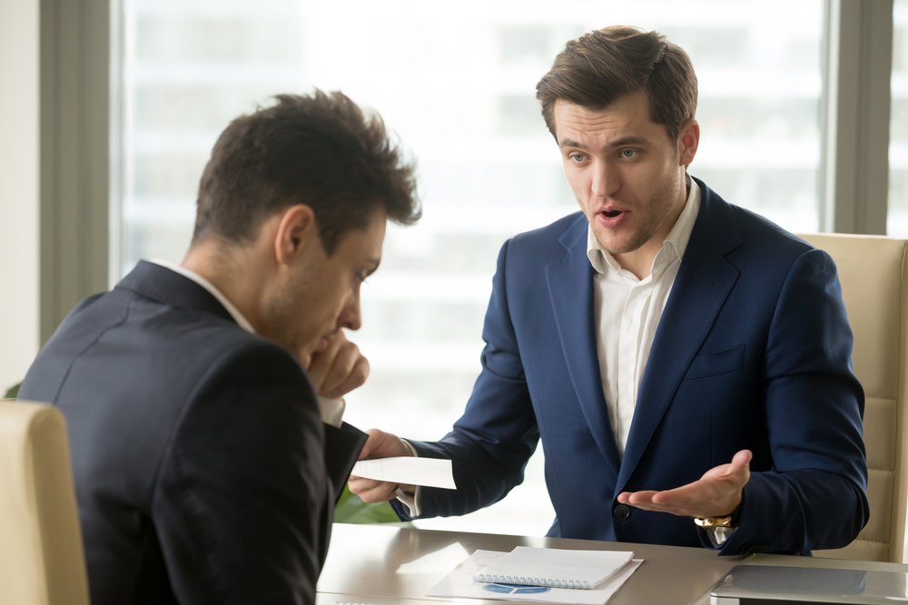 Angry boss yelling at employee. Know how to have a healthy work-life balance to be productive at work.