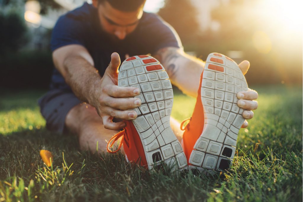 A man doing a morning stretching before jogging.