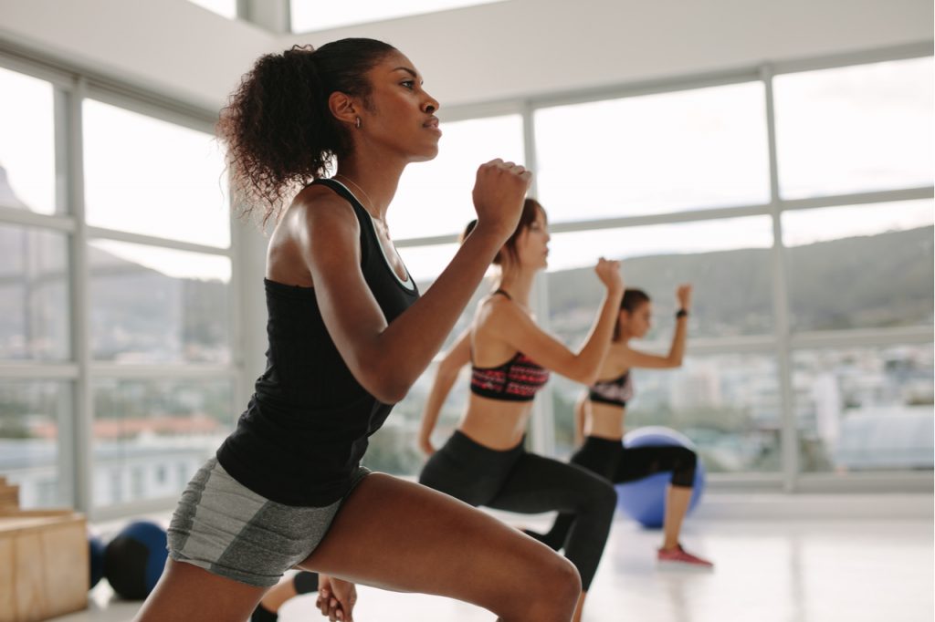 Women doing cardio workout in the gym.