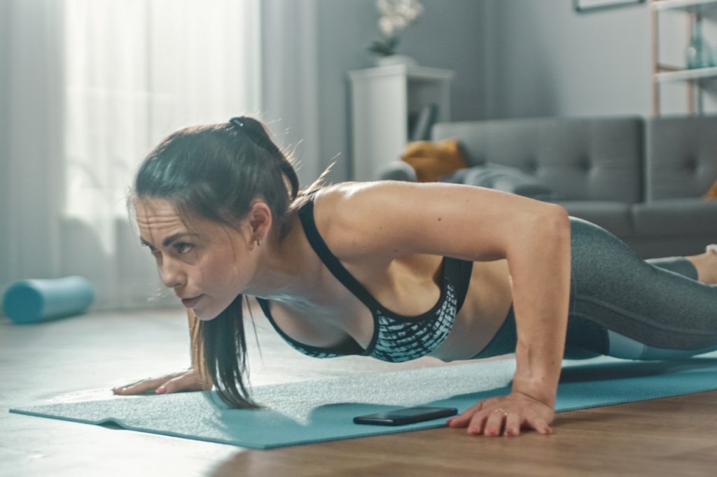A woman exercising at home.