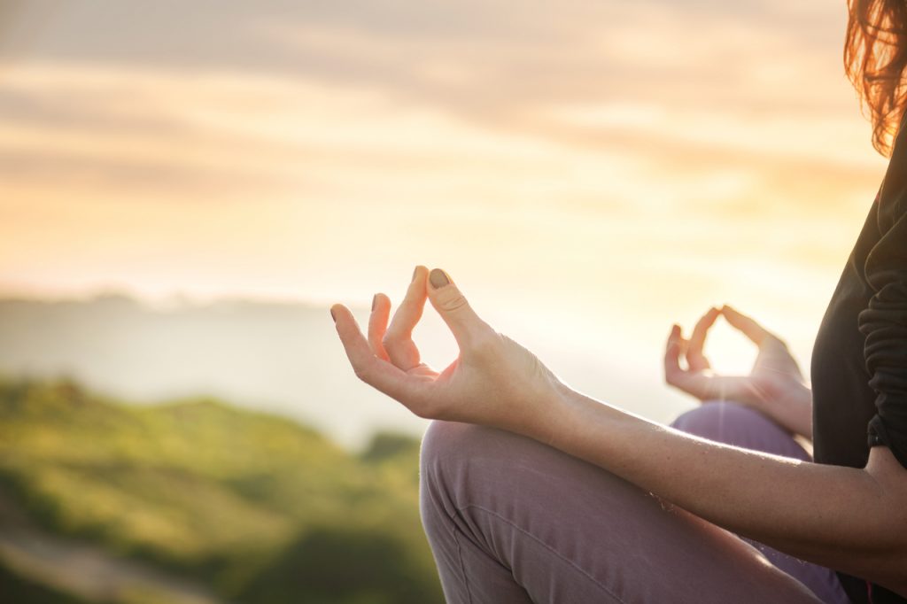 Woman meditating in the morning.