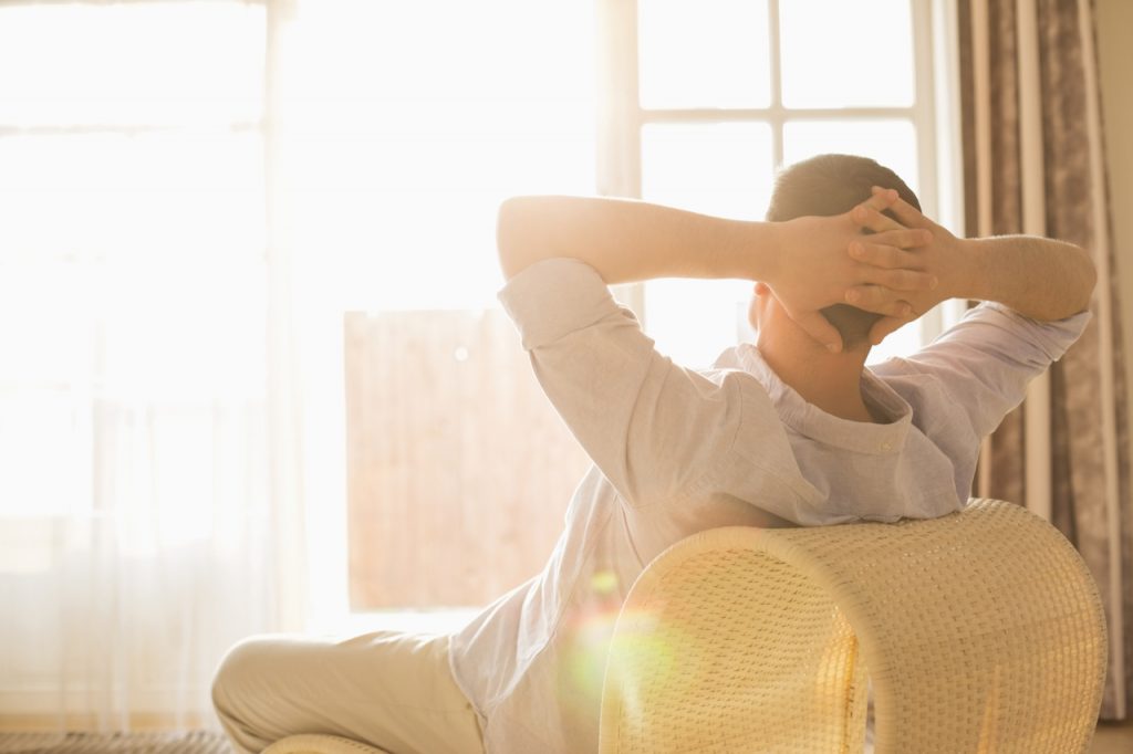 A man relaxing thinking about how to boost immune system.