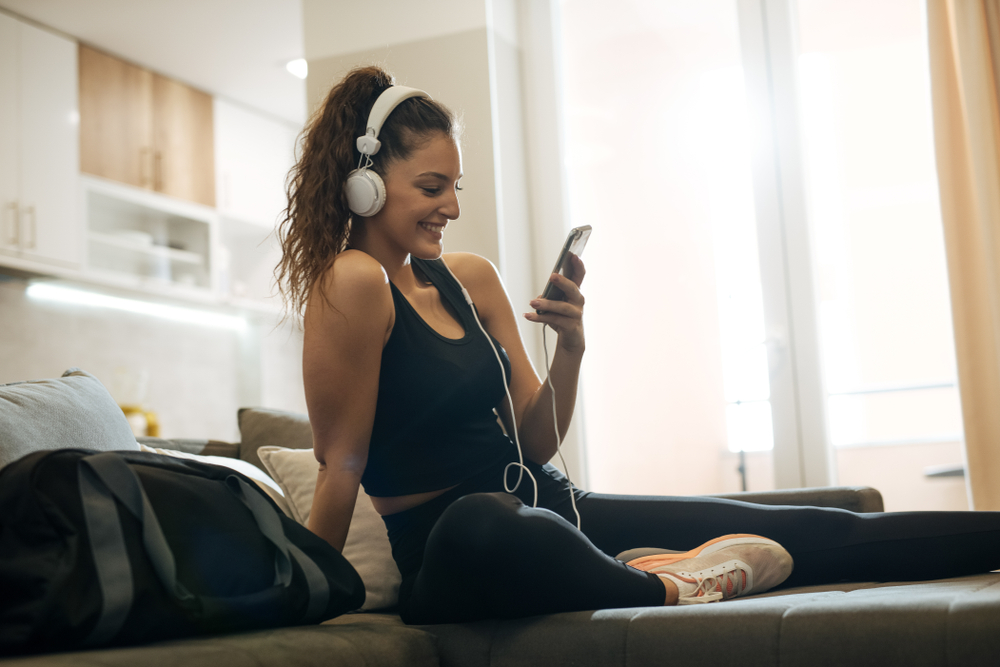 Woman on facetime sitting on a couch.
