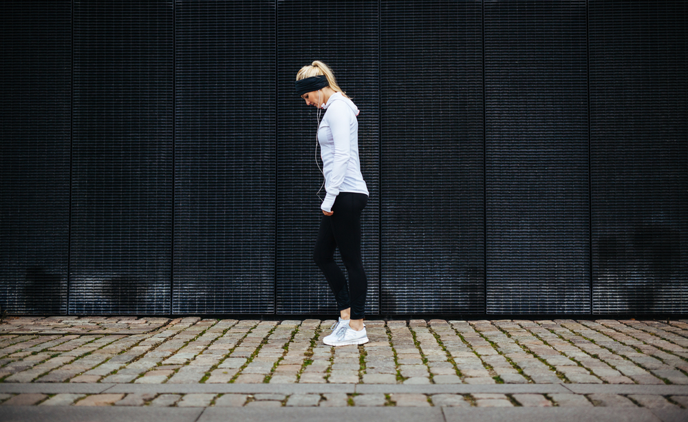 A woman doing solitary stroll.
