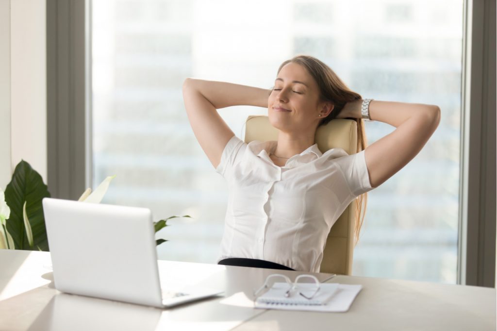 A woman taking a break and relaxing while working.