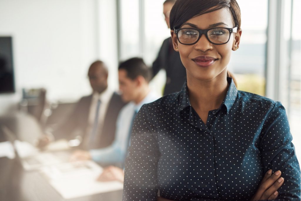 Successful woman in the office. Showing how to become successful.
