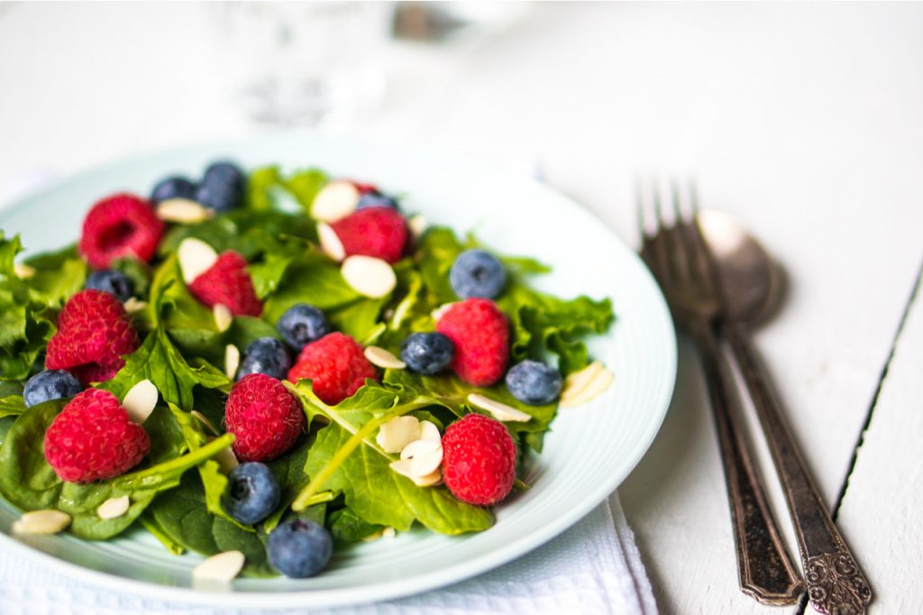 Green salad with berries and almonds.