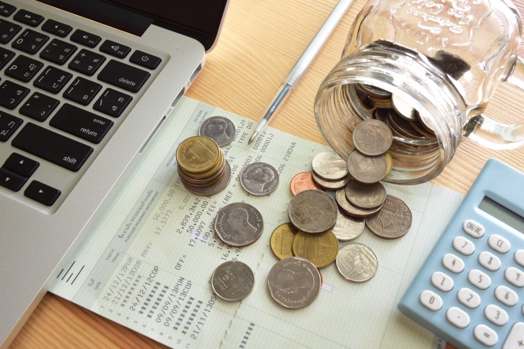 Saving account book and statement from bank for money management.