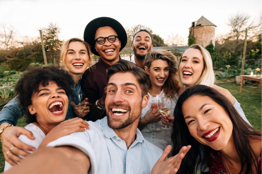A groupfie of happy friends.