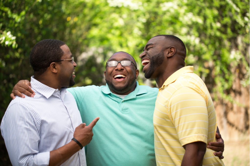 Brothers laughing, having fun while catching up.