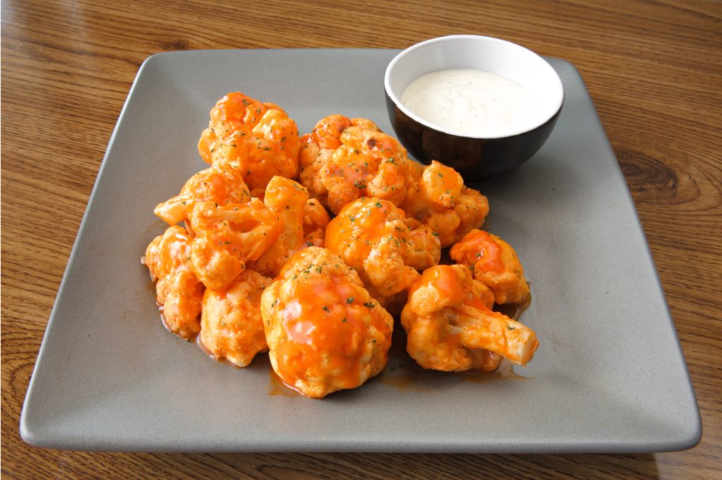 Buffalo-style cauliflower dish with ranch sauce as part of the new BBQ recipes.