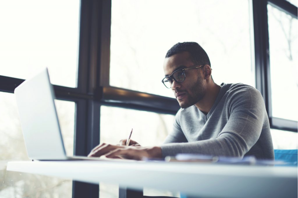 Male professional freelancer working on clients project.