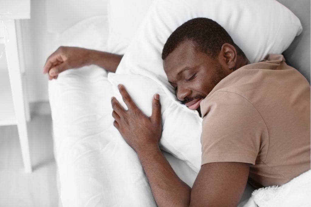 Man getting plenty of quality sleep as a first step on how to strengthen immune system.