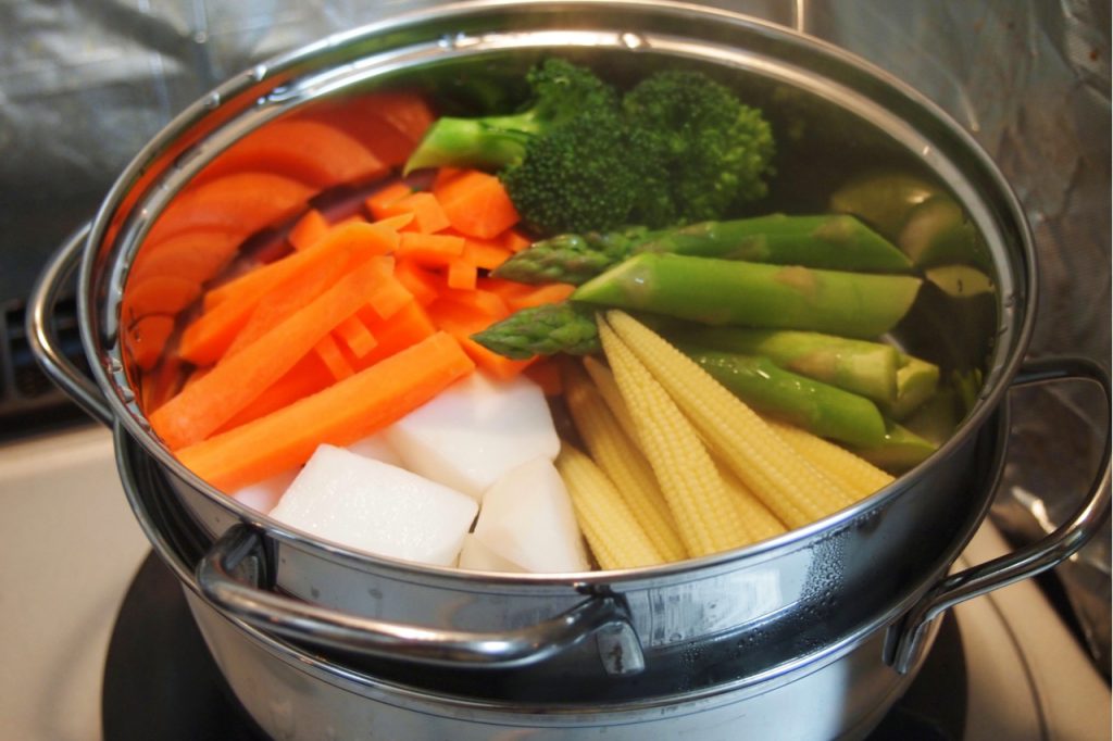 Steaming Vegetables in a pot.