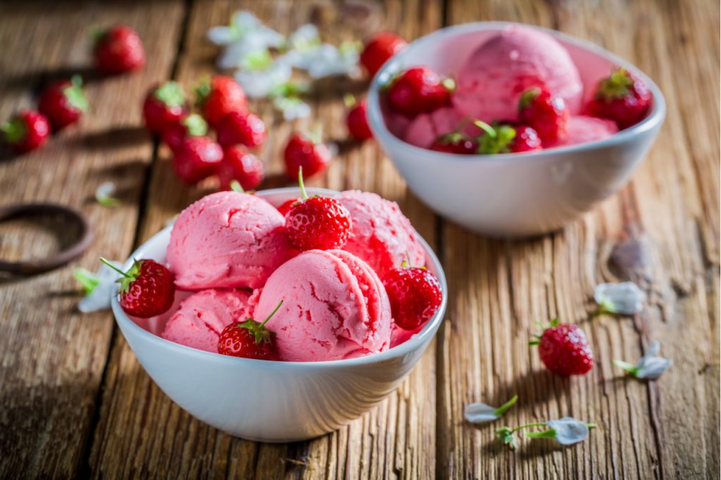 Tasty ice cream with strawberries made of fresh fruits.
