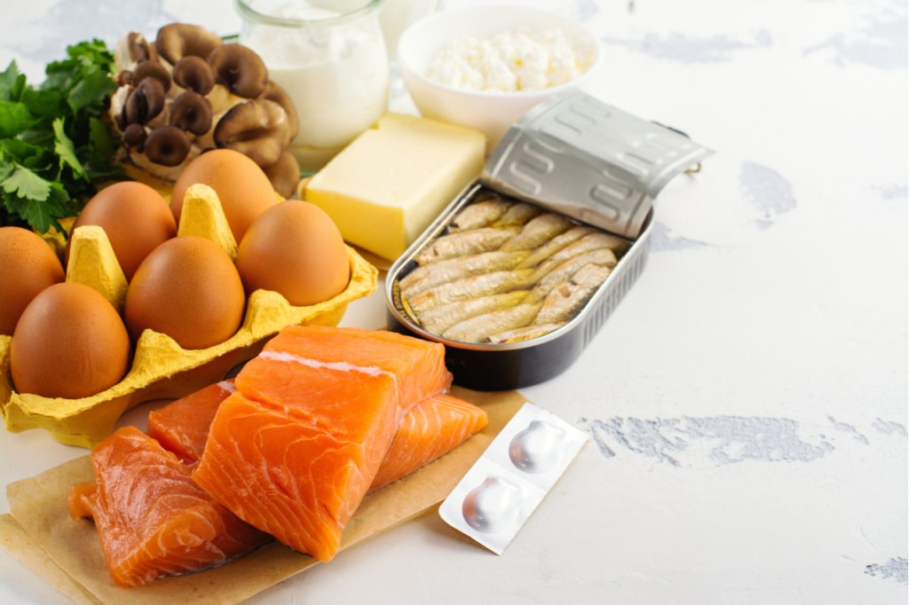 Natural sources of vitamin D and vitamin D capsules.