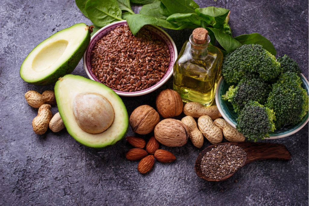 Vegan benefits of omega 3 fatty acid sources flax, spinach, broccoli, nuts, olive, oil and avocado.