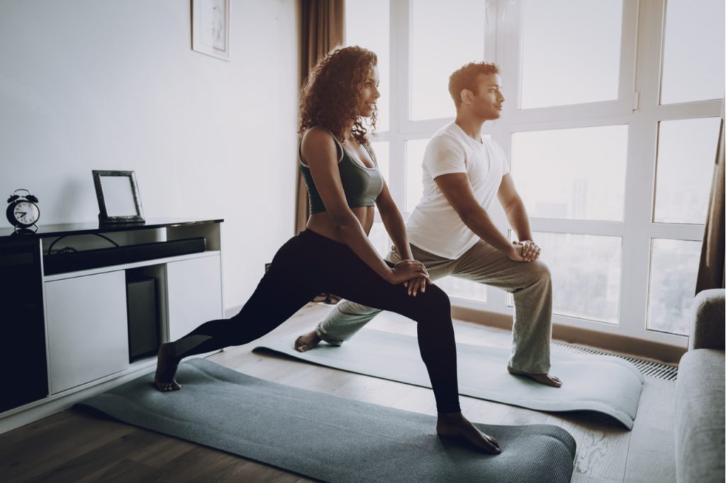 Couple exercising together in the morning.