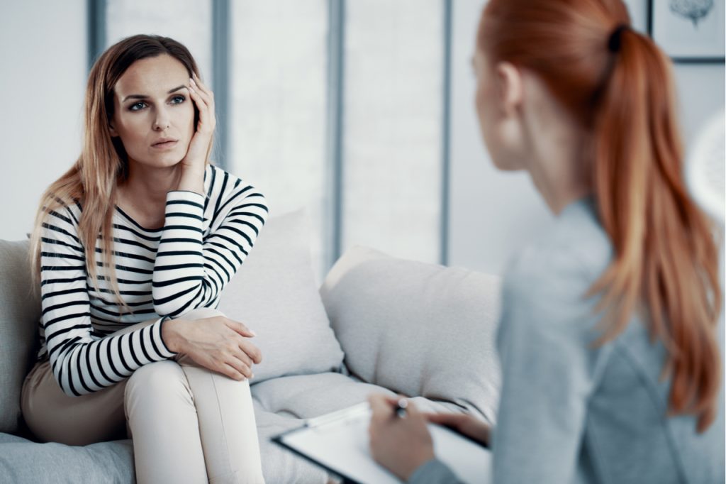 A woman consulting a psychiatrist.
