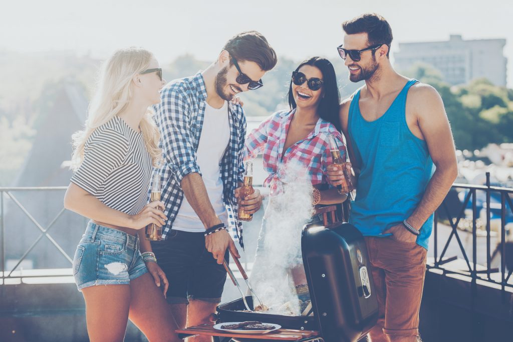 A group of friends enjoying a barbecue party on labor day.