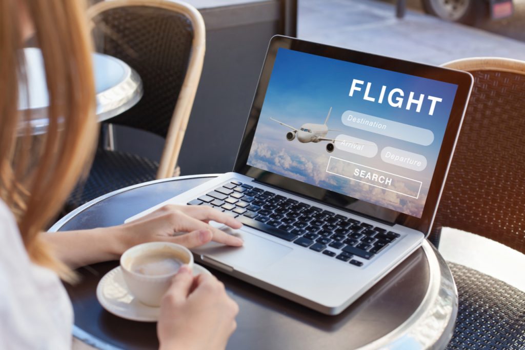 A woman booking her flight online.