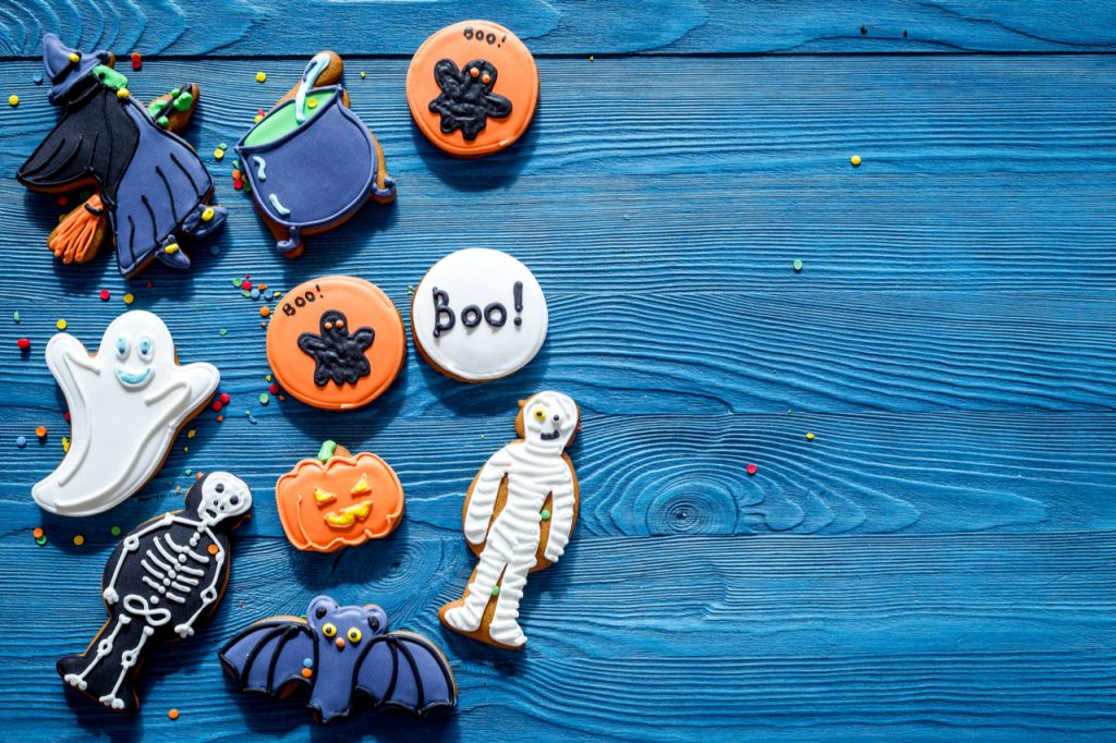 Cook Halloween gingerbread cookies with witch, bat